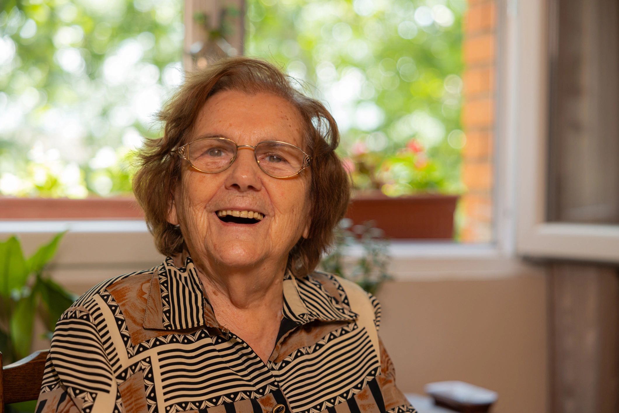 smiling elderly woman care home