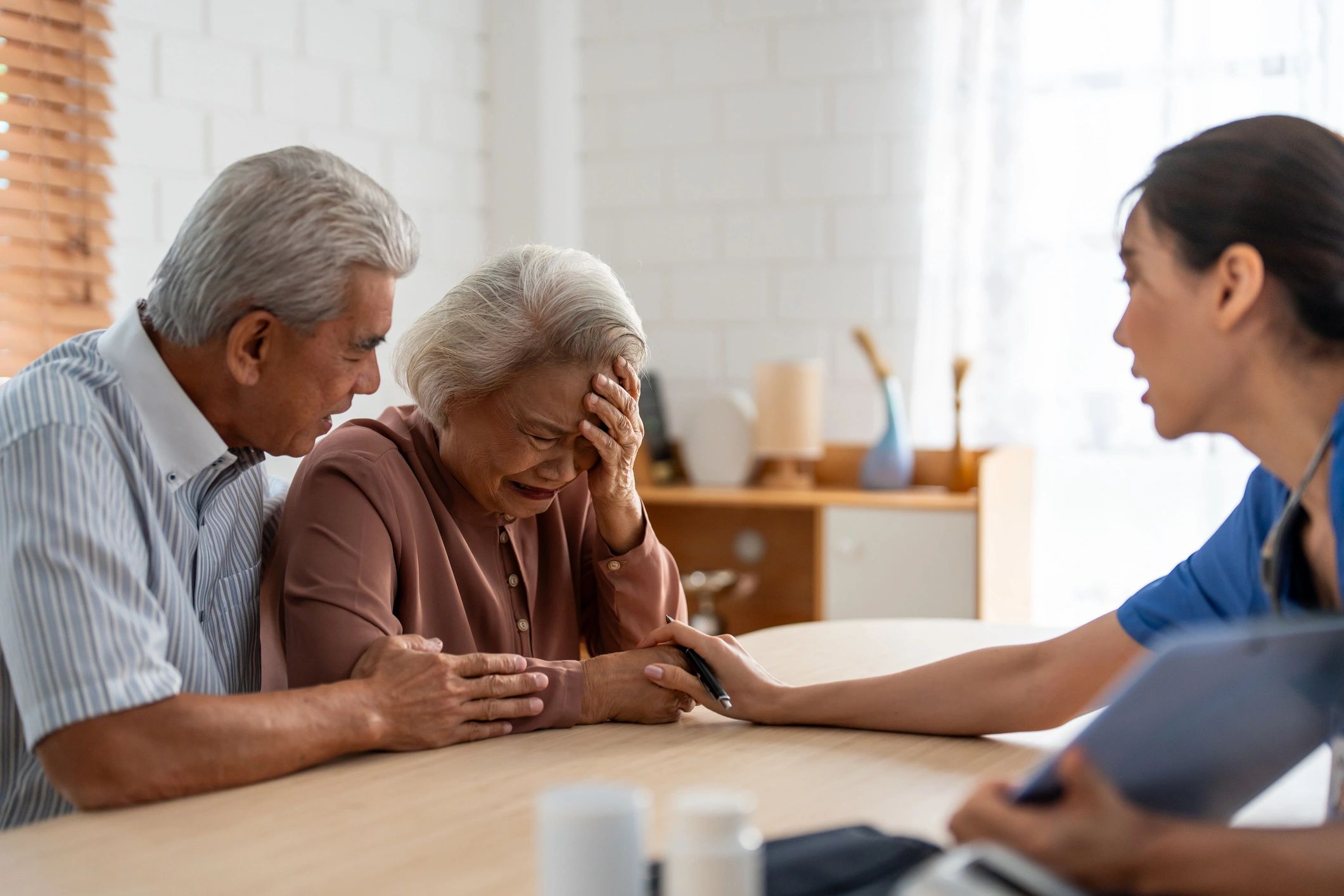 elderly man smiling with caregiver