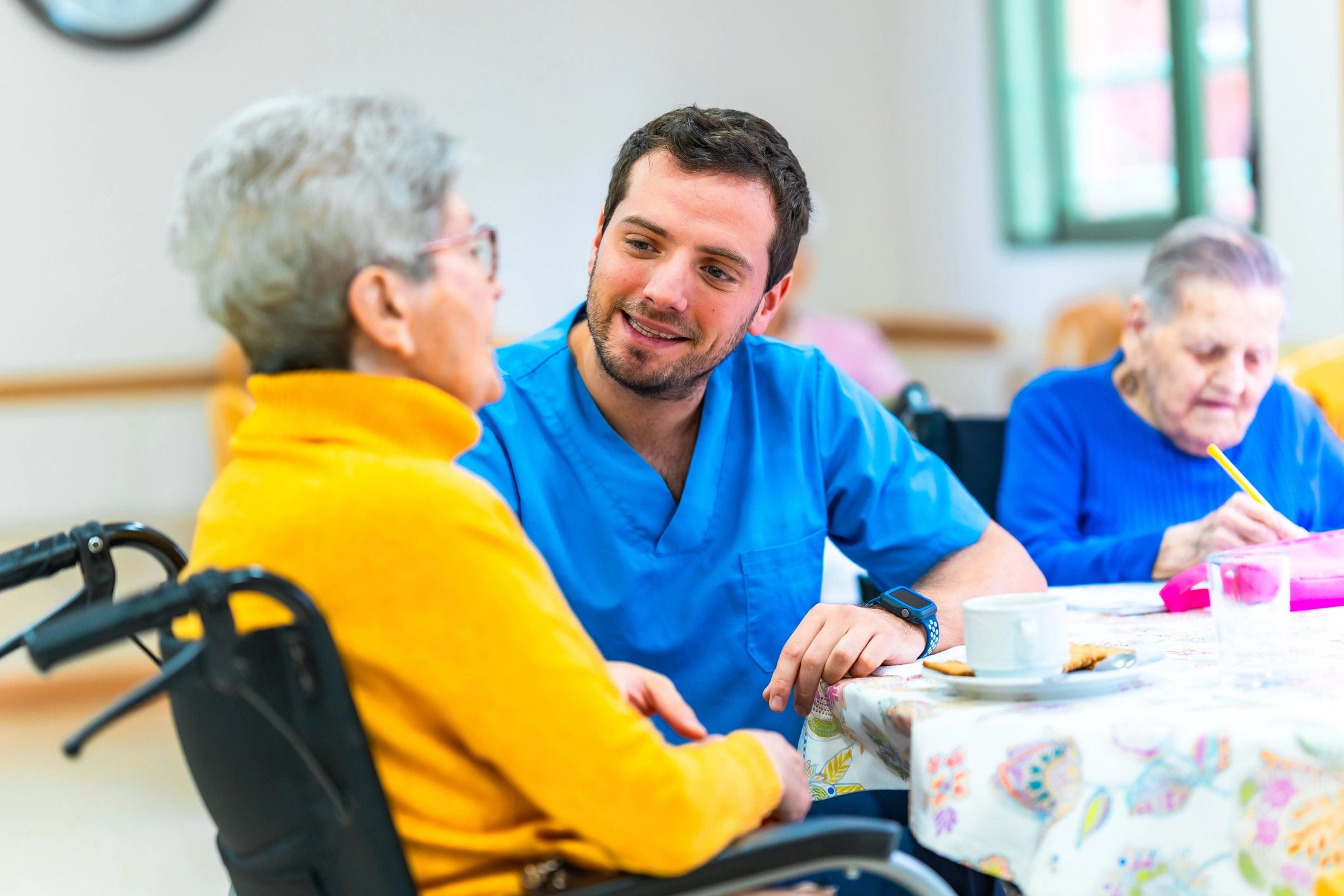 caregiver assisting elderly woman
