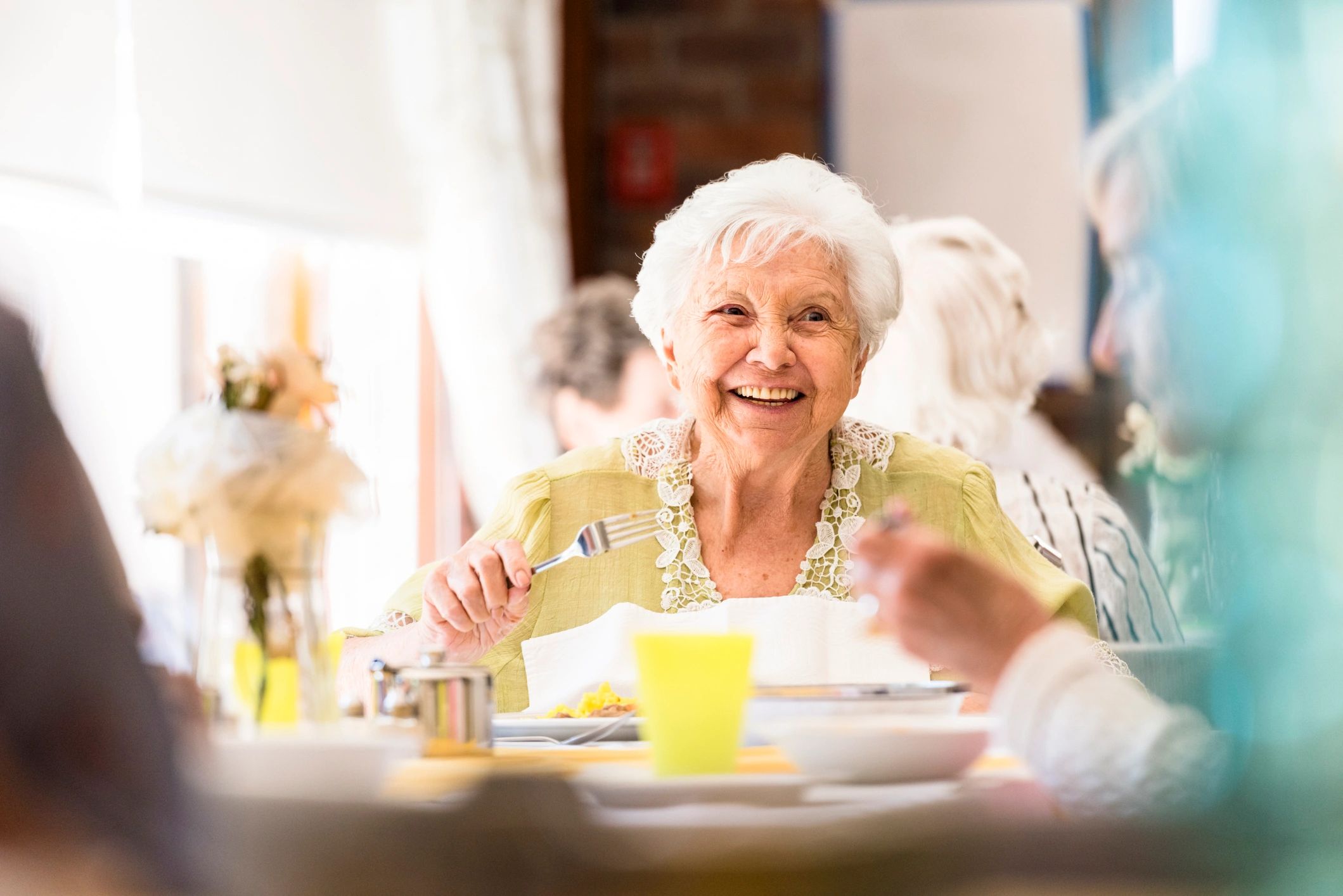 smiling elderly woman care home