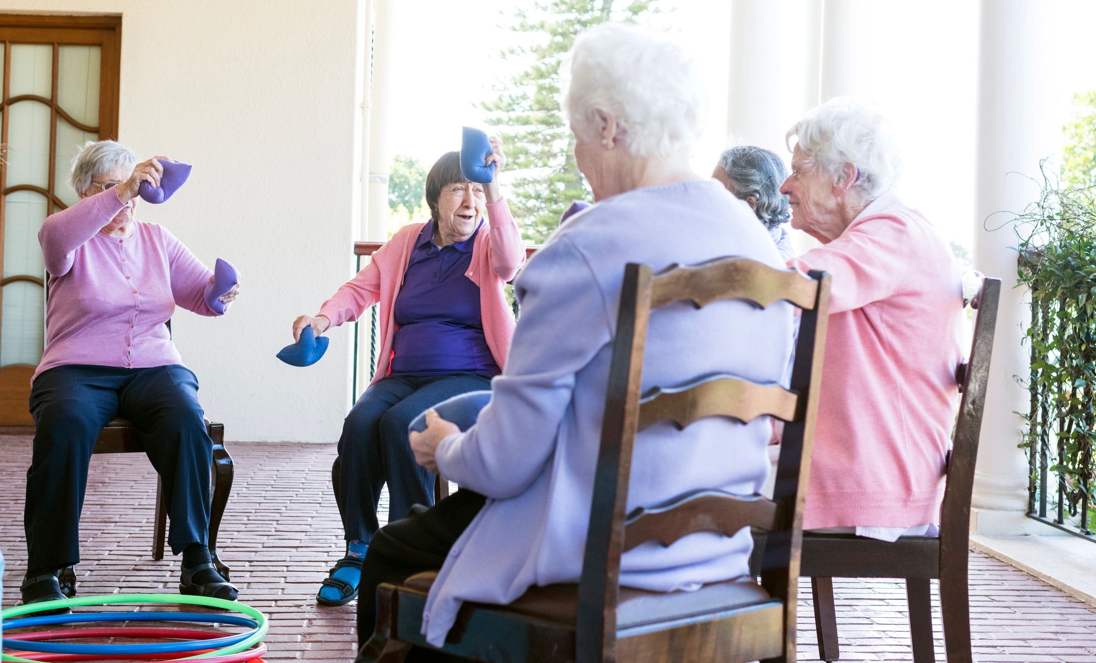 Group of elderly residents enjoying a care home activity
